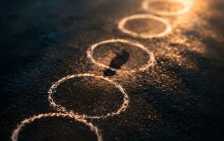 Abstract repeated circular patterns with a single step representing variation and choice in Constellations play