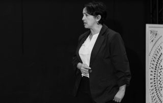 Black and white rehearsal photo of actress in Constellations during Edinburgh Fringe 2026 preparation, focused and mid-performance